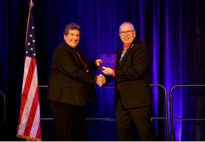 Sam Carney is presented with the Pork Industry Hall of Fame award in recognition of his contributions to the pork industry.