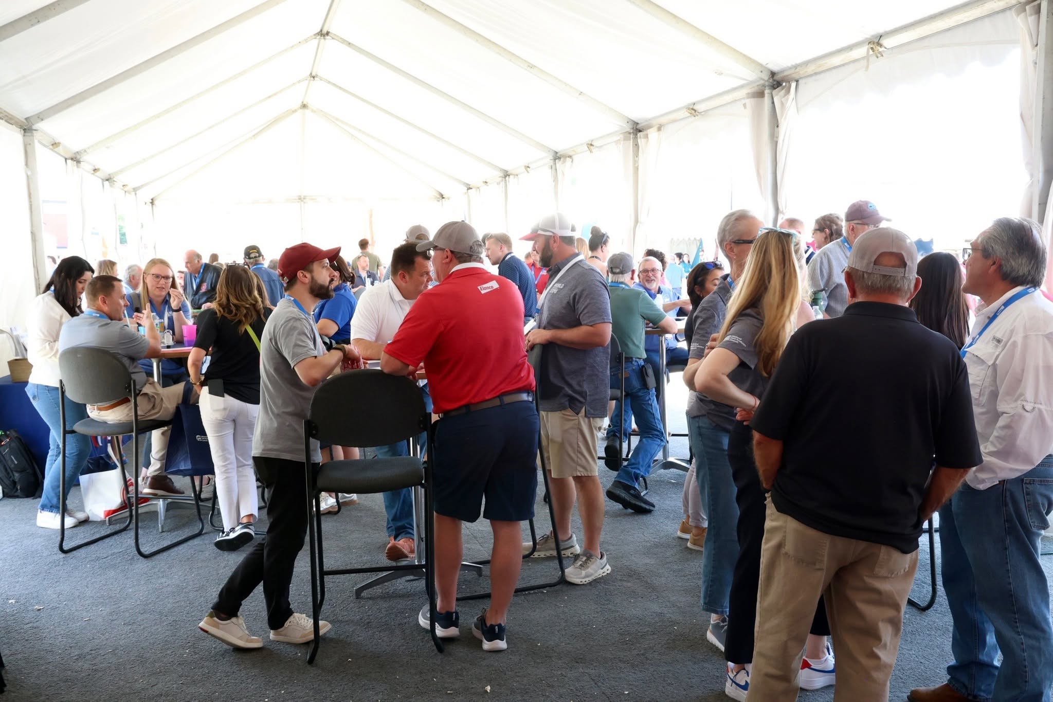 Pork producers and fellow industry professionals gather in the NPPC tent before lunch.